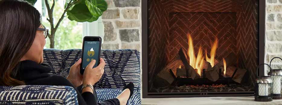 Controlling an electric fireplace with an app on your phone lifestyle image