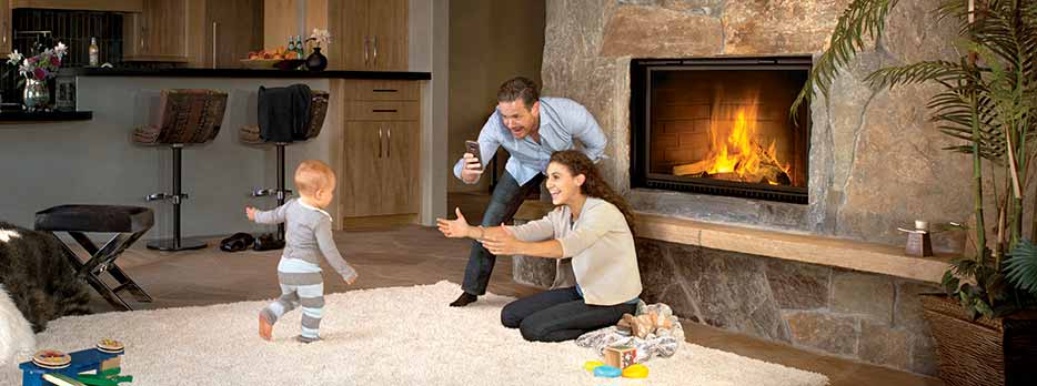 Napoleon High Country Wood Fireplace lifestyle with family recording babies first steps